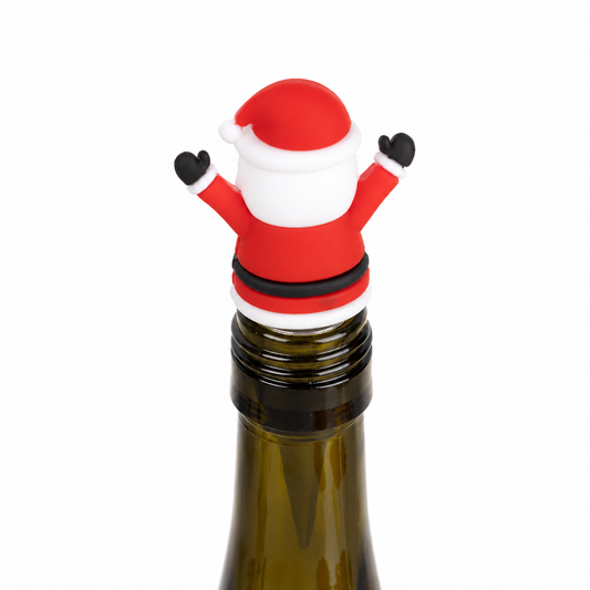 A Santa Claus-shaped bottle stopper resting on the neck of a dark glass bottle, isolated on a white background.