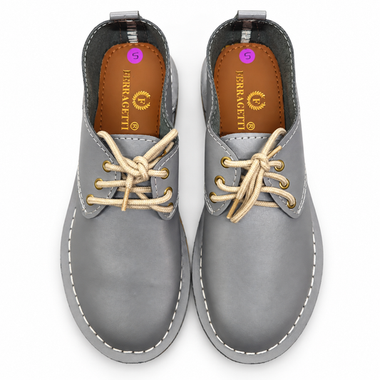 Grey lace-up veldskoen made from genuine leather in South Africa. True-to-size fit, with minor cosmetic imperfections that don’t affect durability. Shop online.