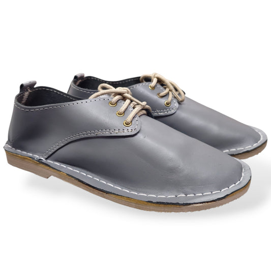 Grey lace-up veldskoen made from genuine leather in South Africa. True-to-size fit, with minor cosmetic imperfections that don’t affect durability. Shop online.
